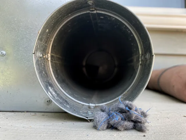 Bellingham Dryer Vent Cleaning technician using specialized equipment to clear severe dryer vent blockage in Bellingham